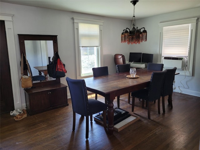 422 Saint Agnes Pl, Franklin Square, NY 11010 - dining space featuring a chandelier, cooling unit, and dark wood finished floors