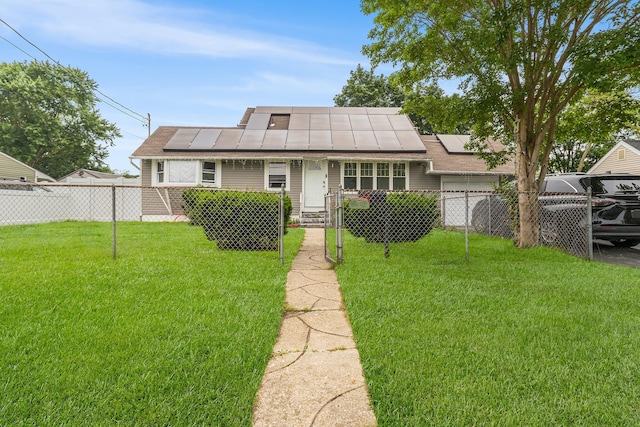 15 E Walnut St, Central Islip, NY 11722 - view of front of home with roof mounted solar panels
