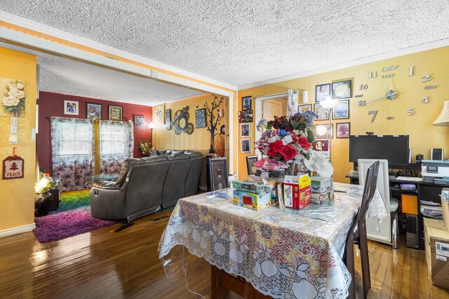 15 E Walnut St, Central Islip, NY 11722 - dining space with a textured ceiling, wood-type flooring, and crown molding