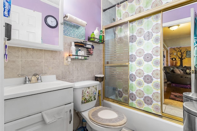 15 E Walnut St, Central Islip, NY 11722 - ensuite bathroom featuring vanity, shower / bath combination with glass door, and tile walls