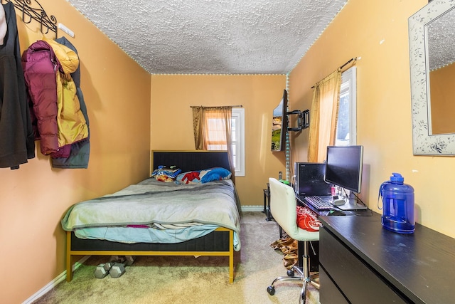 15 E Walnut St, Central Islip, NY 11722 - carpeted bedroom featuring a textured ceiling and a desk