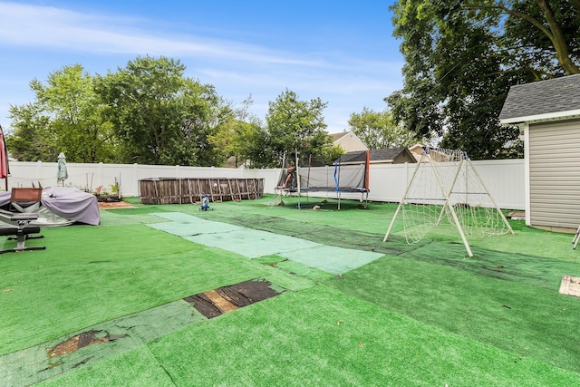 15 E Walnut St, Central Islip, NY 11722 - fenced backyard with a trampoline