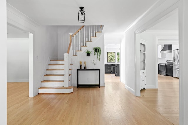 9 Guthrie Ct, East Northport, NY 11731 - staircase with wood finished floors and crown molding
