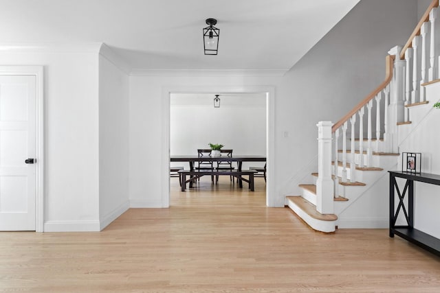 9 Guthrie Ct, East Northport, NY 11731 - foyer entrance featuring light wood-style floors and stairway