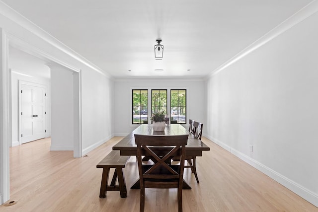 9 Guthrie Ct, East Northport, NY 11731 - dining space featuring crown molding and light wood-style floors