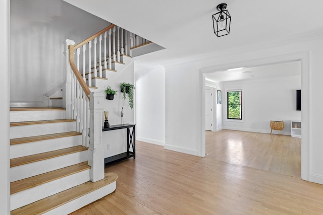 9 Guthrie Ct, East Northport, NY 11731 - stairway featuring wood finished floors and baseboards