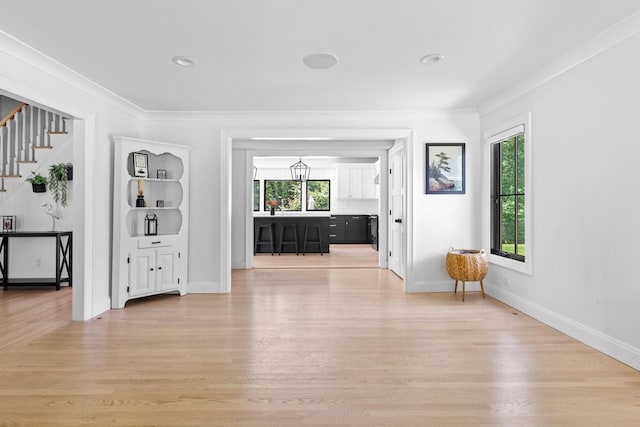 9 Guthrie Ct, East Northport, NY 11731 - unfurnished living room with light wood-style flooring, stairs, crown molding, and recessed lighting