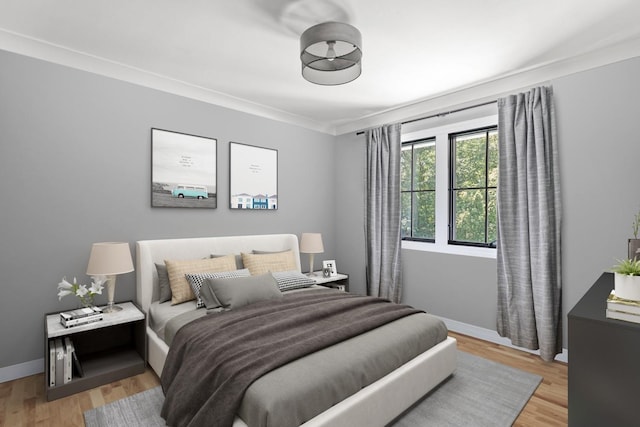 9 Guthrie Ct, East Northport, NY 11731 - bedroom featuring light wood-style floors and crown molding