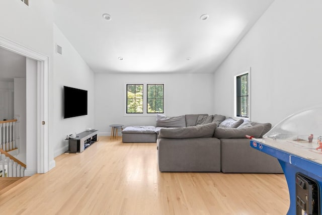 9 Guthrie Ct, East Northport, NY 11731 - living area with vaulted ceiling and wood finished floors