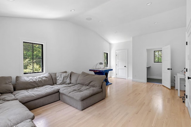 9 Guthrie Ct, East Northport, NY 11731 - living room with vaulted ceiling, light wood finished floors, and recessed lighting