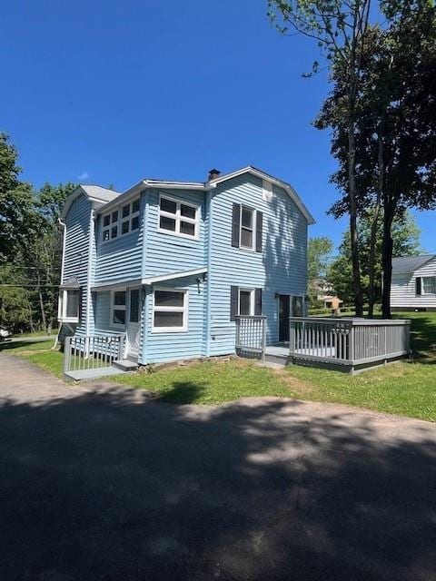 39 Winslow Pl, Liberty, NY 12754 - view of front of property featuring a wooden deck, a porch, and a chimney