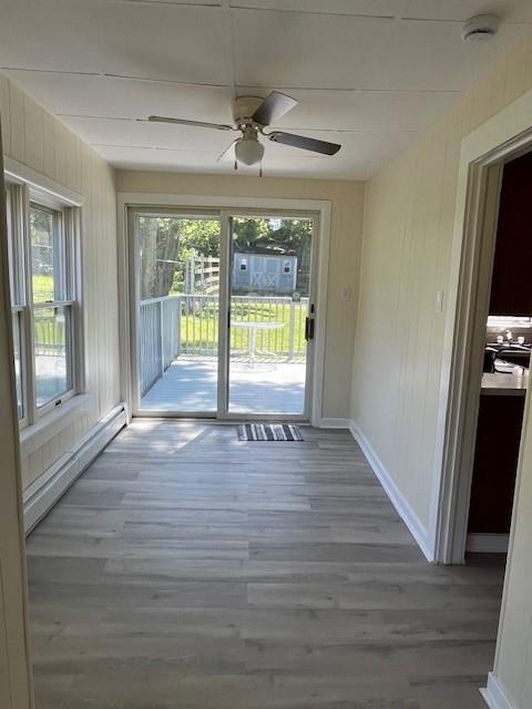 39 Winslow Pl, Liberty, NY 12754 - spare room with a baseboard radiator, a smoke detector, wood finished floors, and ceiling fan