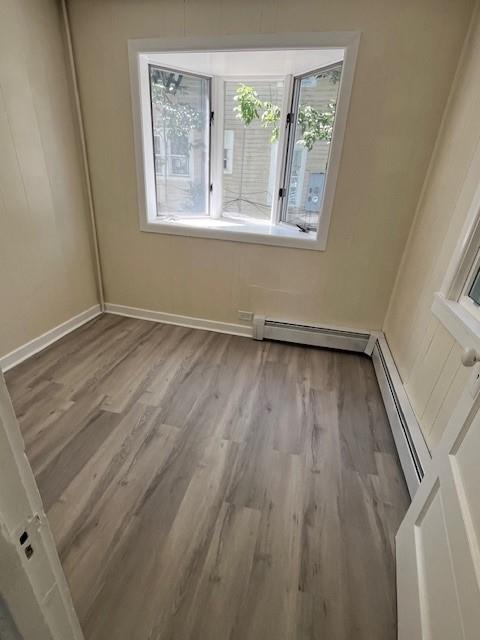 39 Winslow Pl, Liberty, NY 12754 - unfurnished room featuring wood finished floors and baseboard heating
