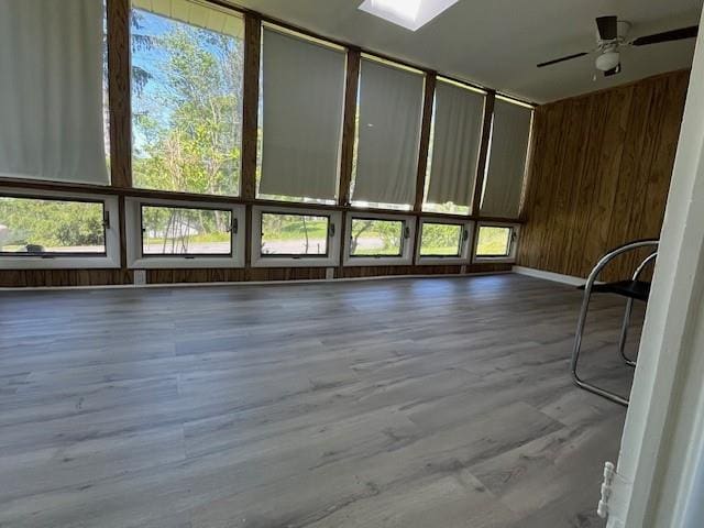 39 Winslow Pl, Liberty, NY 12754 - empty room with a ceiling fan, wooden walls, and wood finished floors