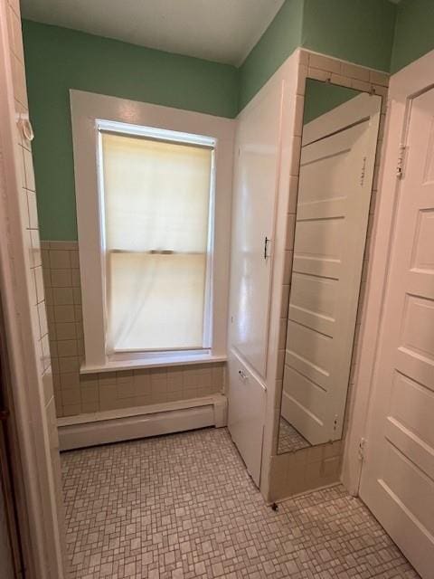 39 Winslow Pl, Liberty, NY 12754 - bathroom with baseboard heating and tile patterned floors