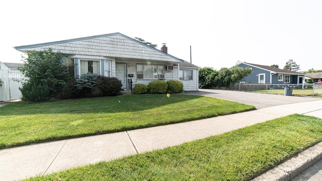 14 Lois Ln, Farmingdale, NY 11735 - bungalow-style home featuring a chimney, driveway, and covered porch