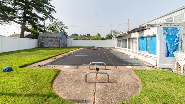 14 Lois Ln, Farmingdale, NY 11735 - view of swimming pool featuring a shed, a fenced backyard, and a patio