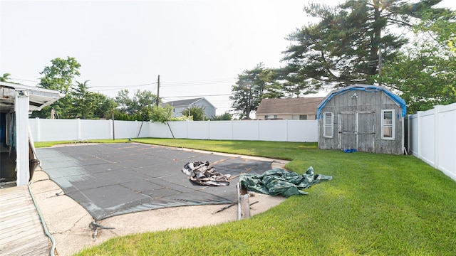 14 Lois Ln, Farmingdale, NY 11735 - fenced backyard with a shed and a patio area