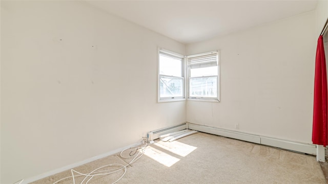14 Lois Ln, Farmingdale, NY 11735 - spare room with carpet flooring and baseboard heating
