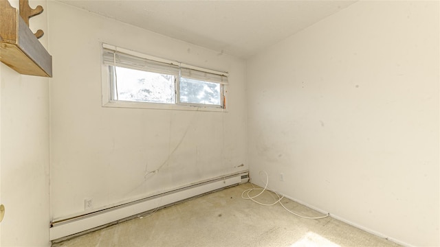 14 Lois Ln, Farmingdale, NY 11735 - empty room with a baseboard radiator and carpet