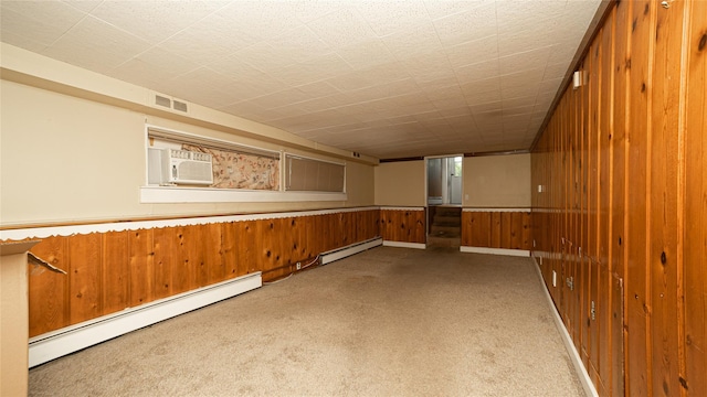 14 Lois Ln, Farmingdale, NY 11735 - carpeted spare room with a baseboard radiator, wood walls, and wainscoting