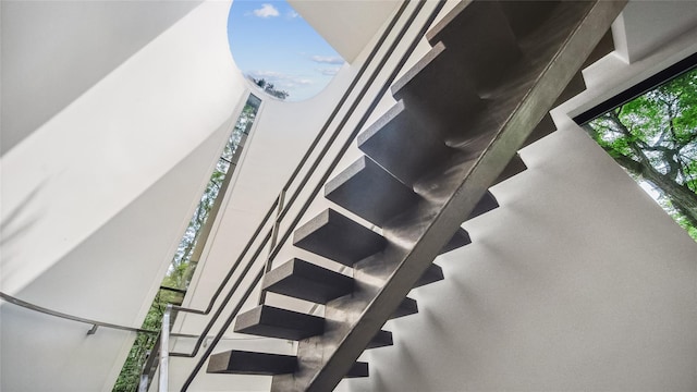 stairs featuring plenty of natural light