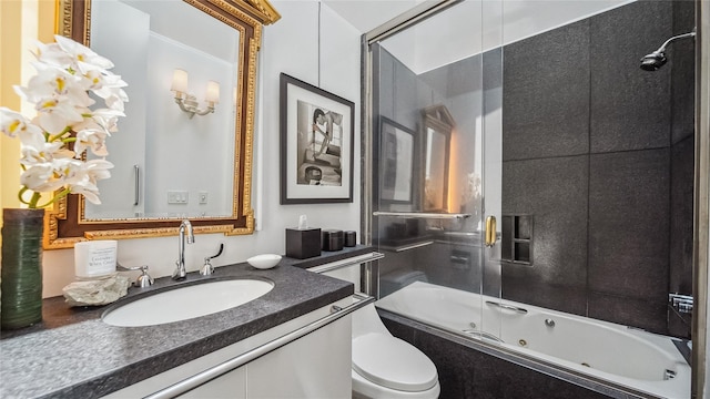 bathroom with a combined bath / shower with jetted tub and vanity