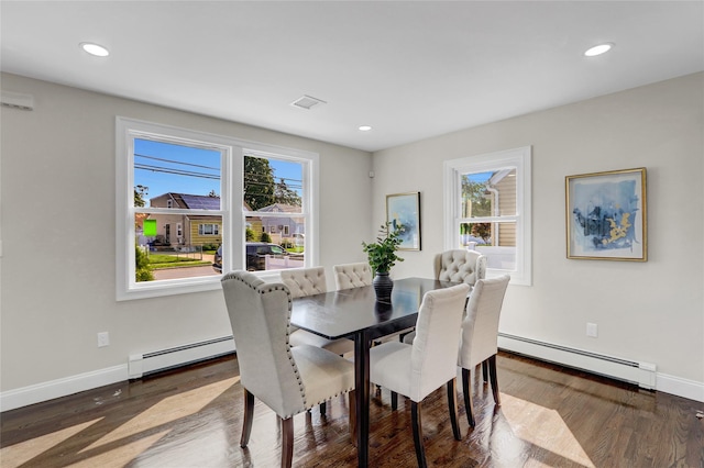 10 Branch Pl, Roosevelt, NY 11575 - dining space with a baseboard radiator, wood finished floors, and recessed lighting