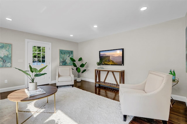 10 Branch Pl, Roosevelt, NY 11575 - living area featuring wood finished floors and recessed lighting