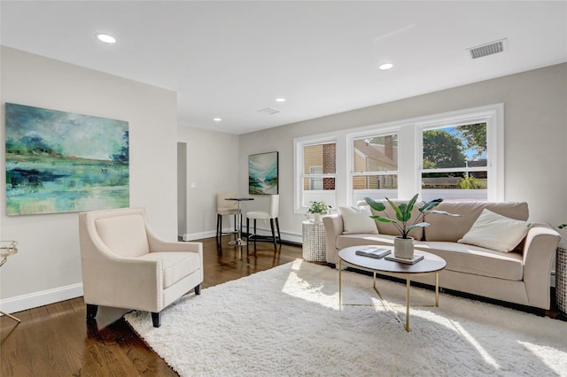 10 Branch Pl, Roosevelt, NY 11575 - living area featuring wood finished floors and recessed lighting