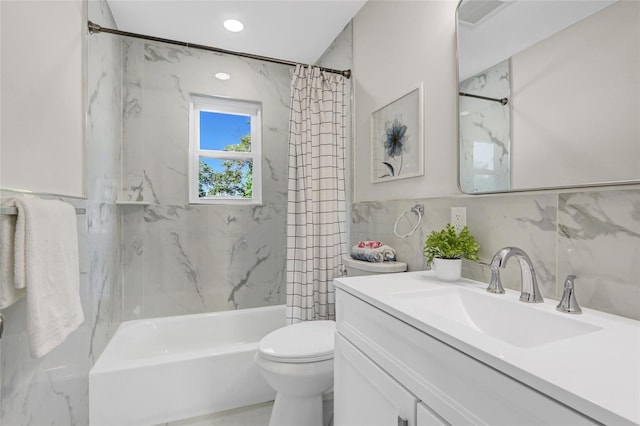 10 Branch Pl, Roosevelt, NY 11575 - bathroom featuring tile walls, vanity, and shower / tub combo