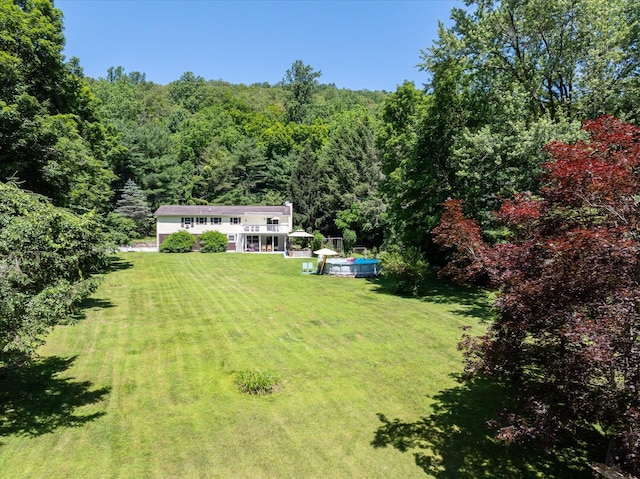 542 Peekskill Hollow Rd, Putnam Valley, NY 10579 - view of grassy yard with a wooded view and a swimming pool