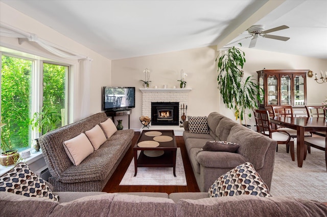 542 Peekskill Hollow Rd, Putnam Valley, NY 10579 - living room featuring lofted ceiling, healthy amount of natural light, a ceiling fan, and a fireplace