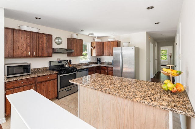 542 Peekskill Hollow Rd, Putnam Valley, NY 10579 - kitchen with appliances with stainless steel finishes, under cabinet range hood, a peninsula, recessed lighting, and light stone countertops