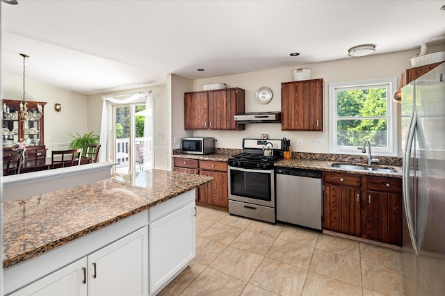 542 Peekskill Hollow Rd, Putnam Valley, NY 10579 - kitchen featuring appliances with stainless steel finishes, white cabinets, dark stone counters, ventilation hood, and light tile patterned floors