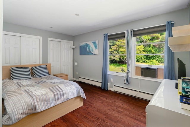 542 Peekskill Hollow Rd, Putnam Valley, NY 10579 - bedroom featuring a baseboard radiator, two closets, wood finished floors, and cooling unit