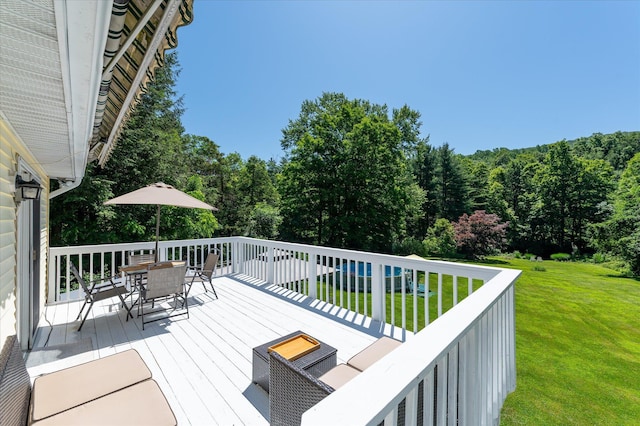 542 Peekskill Hollow Rd, Putnam Valley, NY 10579 - deck featuring outdoor dining area, a yard, and a view of trees