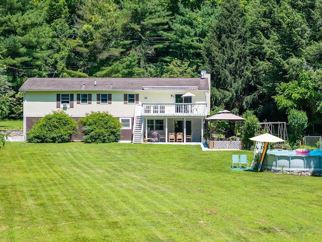 542 Peekskill Hollow Rd, Putnam Valley, NY 10579 - back of property featuring a wooden deck, a chimney, stairway, an outdoor pool, and a patio area