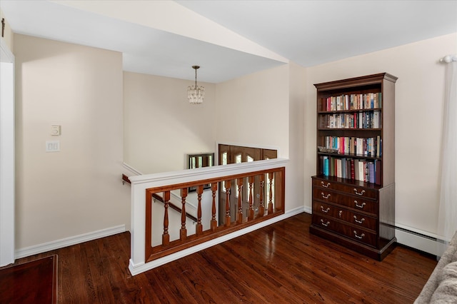 542 Peekskill Hollow Rd, Putnam Valley, NY 10579 - corridor featuring a baseboard heating unit, a chandelier, wood finished floors, an upstairs landing, and lofted ceiling