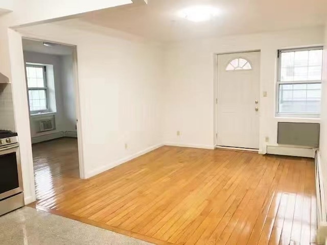 35-06LEAVITTST3J Leavitt St, Flushing, NY 11354 - foyer featuring light wood-style flooring and a wall mounted AC