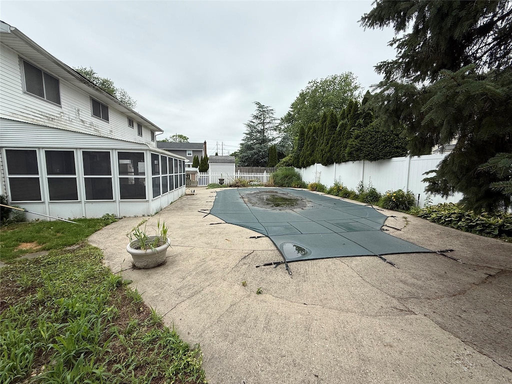 331 Gillette St, Dix Hills, NY 11746 - view of pool featuring a fenced backyard, a patio, and a sunroom