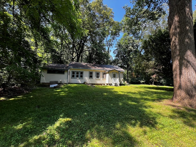 2 Briar Ln, Crompond, NY 10517 - back of house featuring a lawn and entry steps
