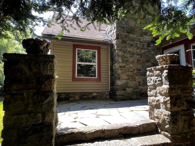 2 Briar Ln, Crompond, NY 10517 - view of side of home with a shingled roof and a patio area