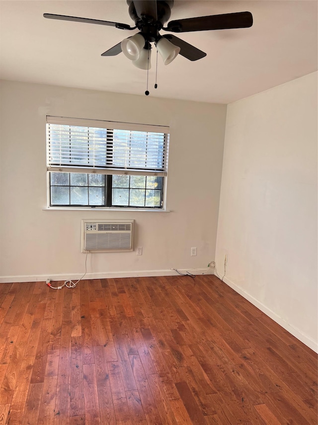 411 121st St Unit 12A, College Point, NY 11356 - unfurnished room featuring a wall mounted air conditioner, hardwood / wood-style floors, and a ceiling fan