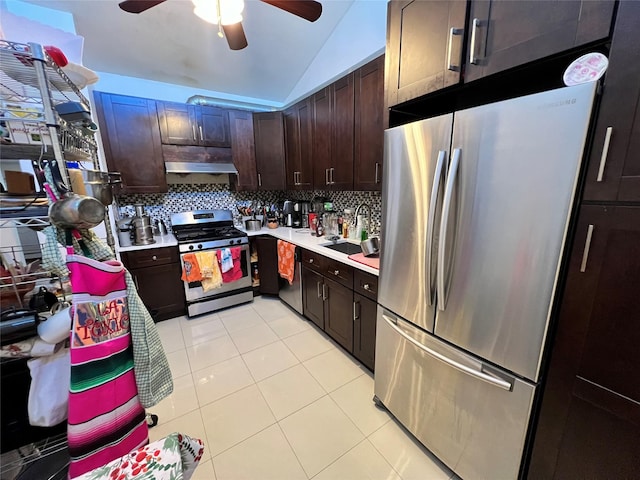 411 121st St Unit 12A, College Point, NY 11356 - kitchen with stainless steel appliances, lofted ceiling, light countertops, tasteful backsplash, and light tile patterned floors