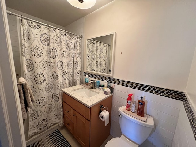411 121st St Unit 12A, College Point, NY 11356 - full bathroom featuring vanity, wainscoting, tile patterned floors, and tile walls