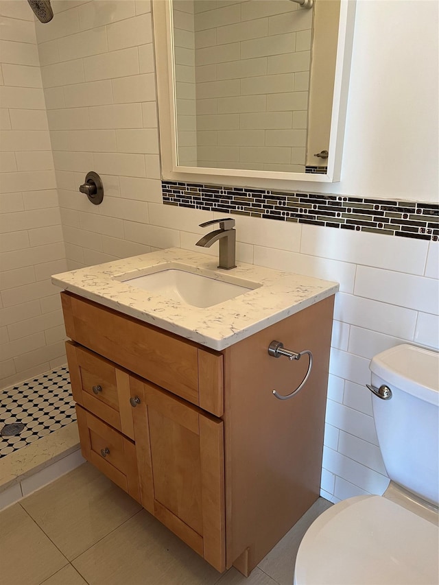 411 121st St Unit 12A, College Point, NY 11356 - bathroom with tile walls, vanity, a tile shower, and tile patterned floors