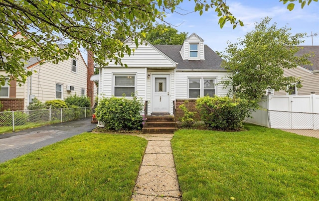 243 Ivy St, West Hempstead, NY 11552 - new england style home with roof with shingles and brick siding