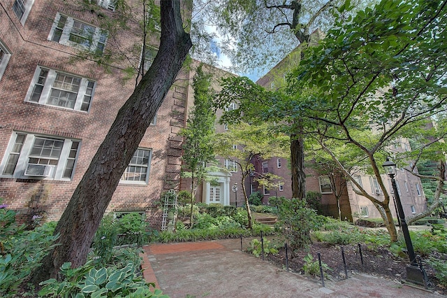117-01 Park Ln S Unit C5D, Kew Gardens, NY 11415 - view of front of property featuring brick siding and cooling unit