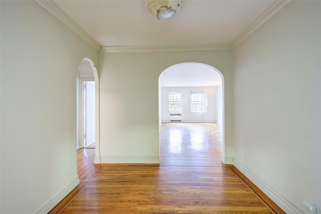 117-01 Park Ln S Unit C5D, Kew Gardens, NY 11415 - hall with arched walkways, wood finished floors, and crown molding